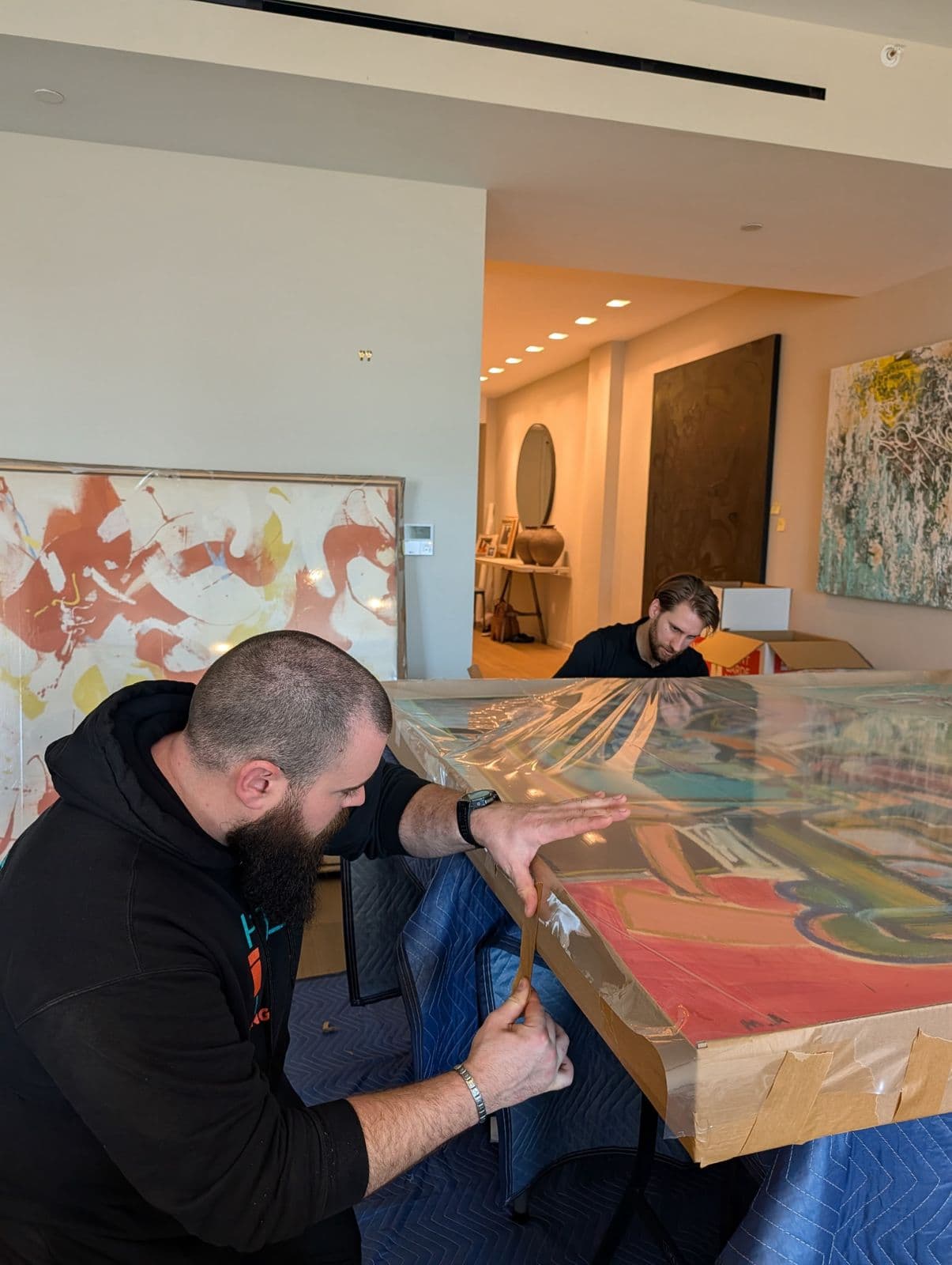 Professional fine art movers handling valuable artwork