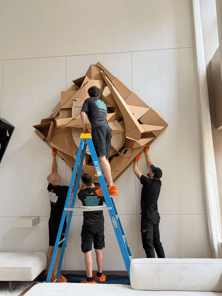 Professional fine art movers handling valuable artwork